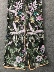 Embroidered floral and leaf pattern on a black background