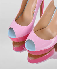 Pink high-heeled shoes with blue soles on a light gray background