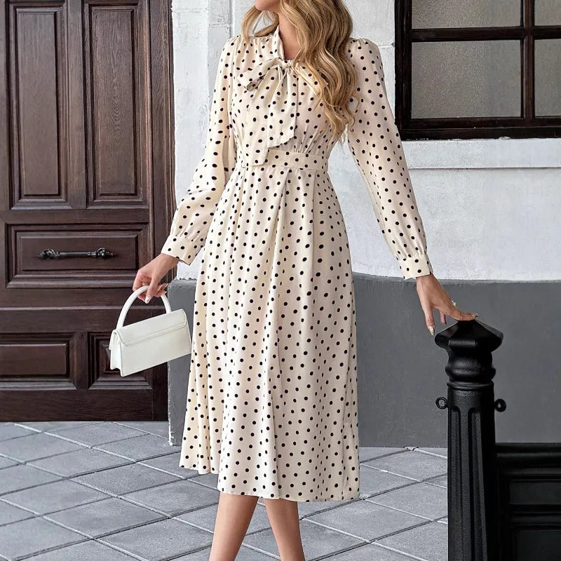 A-line polka dot dress with natural waistline and flowing skirt