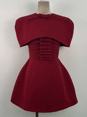 Three-quarter view highlighting the A-line mini skirt flare and smooth fabric structure, styled for a formal party look with minimal accessories.