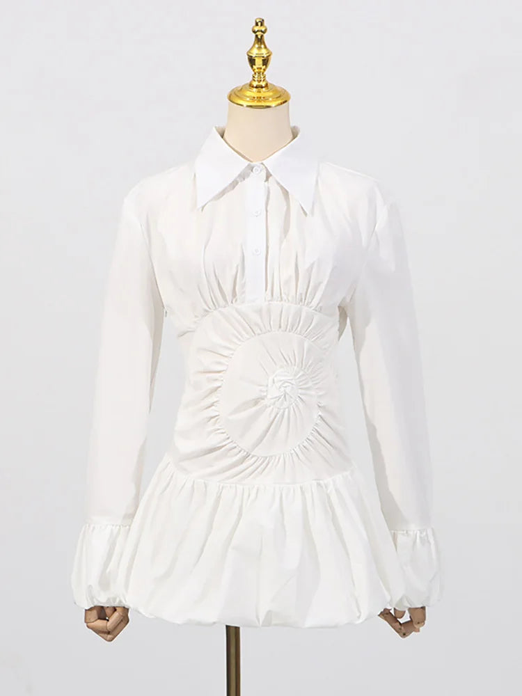 A-line white mini shirt dress styled for cocktail nights on a mannequin against a white background