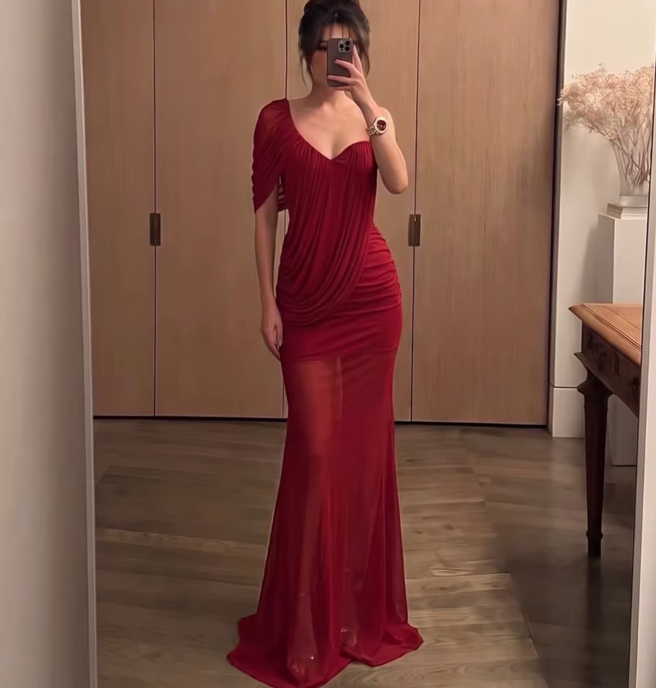 Asymmetrical neckline draped red dress with a fishtail hem