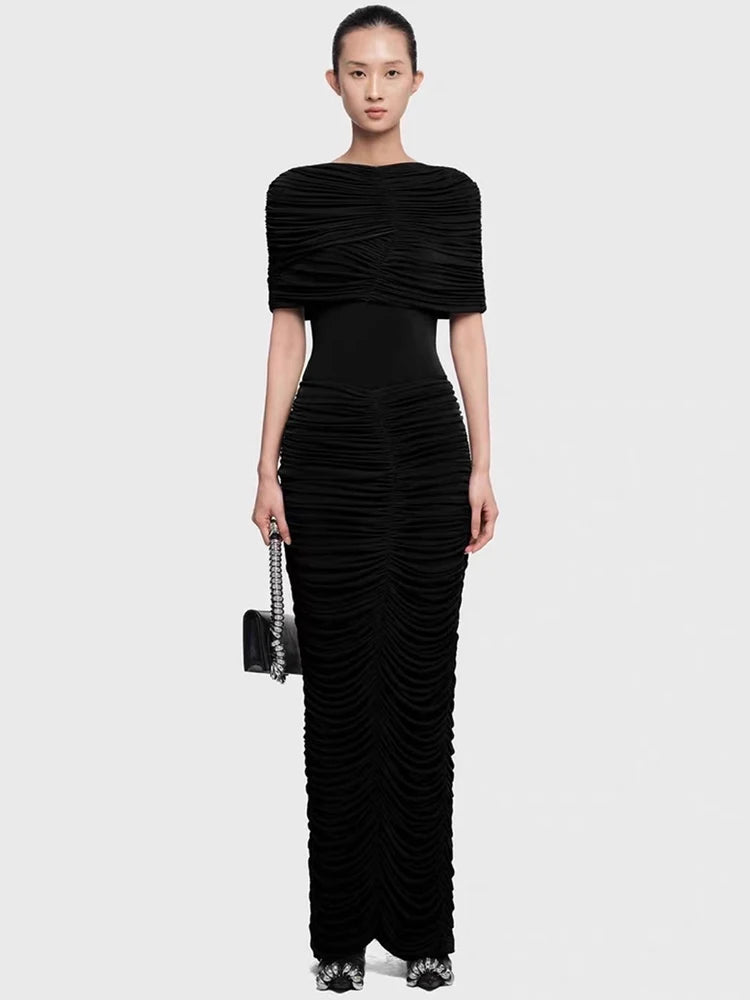 Full-length view highlighting the allover ruching texture and slim fit through the hips, finishing at an ankle-length hem.