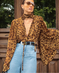 Animal print lace v-neck blouse styled as a statement city top