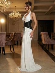 Ankle-length sleeveless halter gown styled for a formal evening