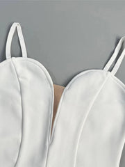 White strappy top on a gray background