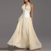 Apricot halter neck maxi dress with corset bodice shown from front