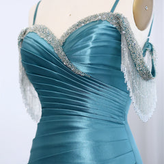 Detail of draped satin mermaid evening gown with slim shoulder straps