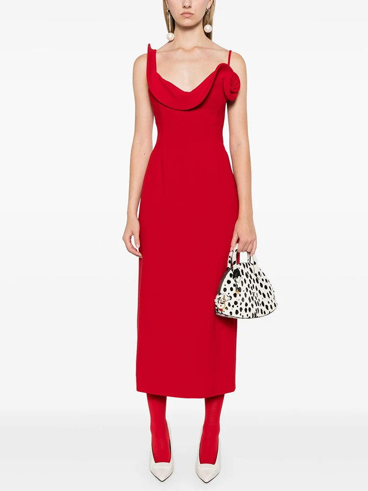Asymmetric structured red cocktail dress photographed for statement wear