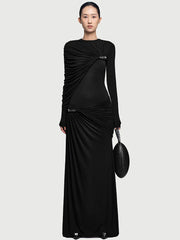 Close-up of the asymmetrical drape across the chest, showing gathered ruching and a sculpted shoulder line with a refined finish.