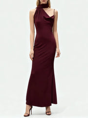 An evening sheath dress, highlighting sculpted waist shaping, fitted posture, and refined back zipper line.