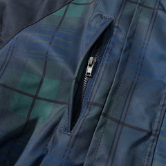Close-up of a blue plaid jacket with a zipper