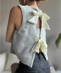 Back angle of gray sleeveless knit vest showing back and armhole fit