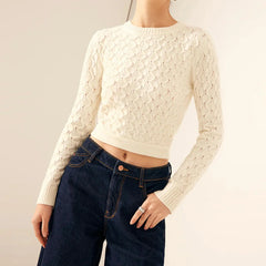Back view of open back bow tied sweater on neutral background