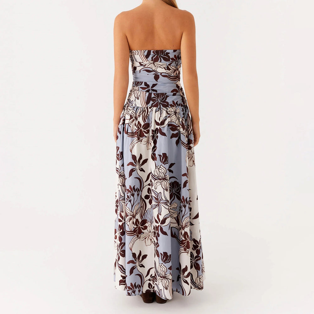 Back view of floral maxi dress with zipper and flowing hem