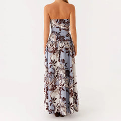 Back view of floral maxi dress with zipper and flowing hem