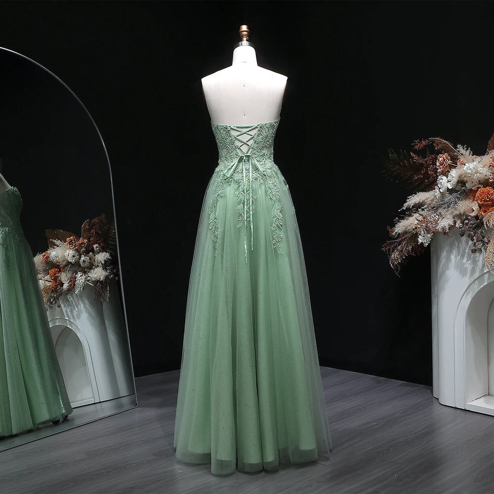 Backless formal dress with fitted bodice and softly draped tulle skirt