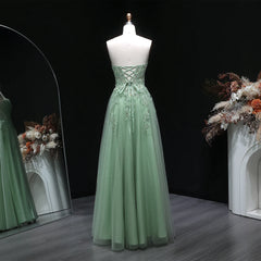 Backless formal dress with fitted bodice and softly draped tulle skirt