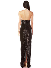 Backless celebrity party gown in black sequins with a white collar, and a high slit on a white background