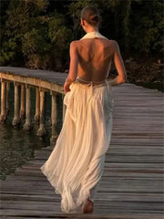 Elegant two-piece vacation outfit with pleated maxi skirt