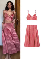 Woman wearing a red and white striped dress next to the dress on a white background