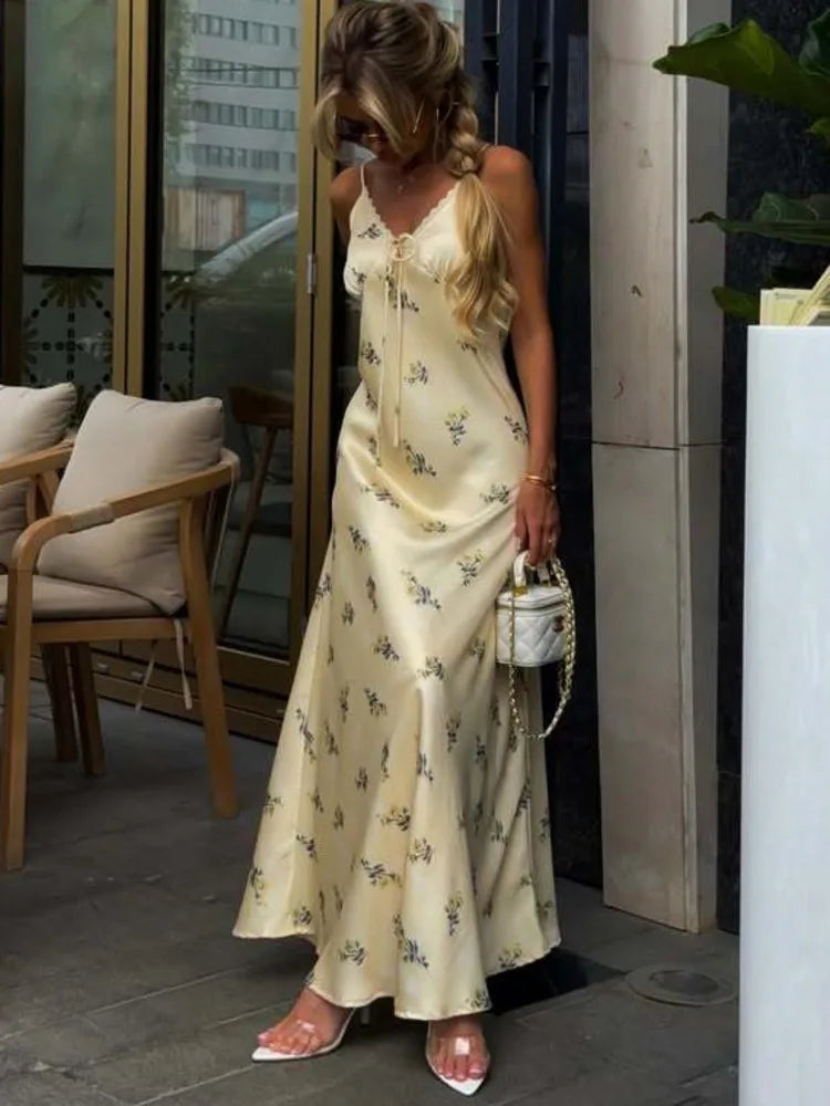 side angle showing backless design and flowing floor length skirt