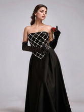 Backless sleeveless evening dress with diamond embellishments