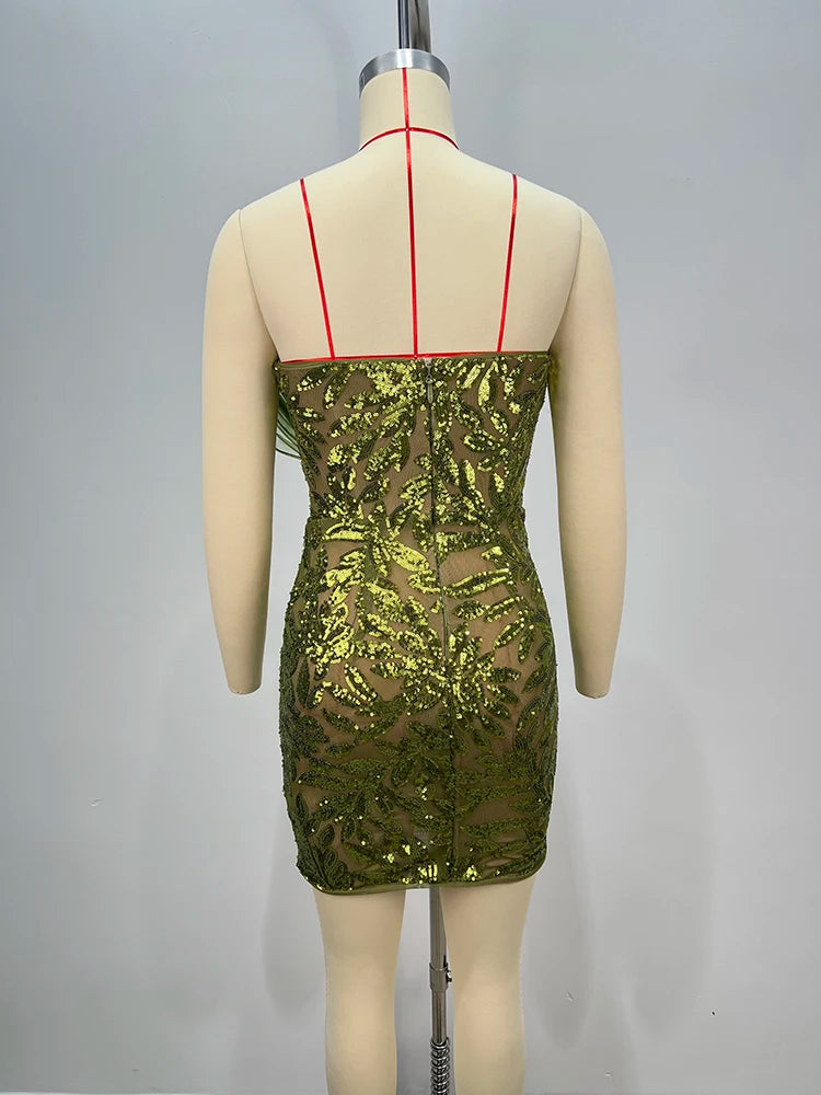 Backless structured evening mini gown in green for parties on a mannequin against a gray background