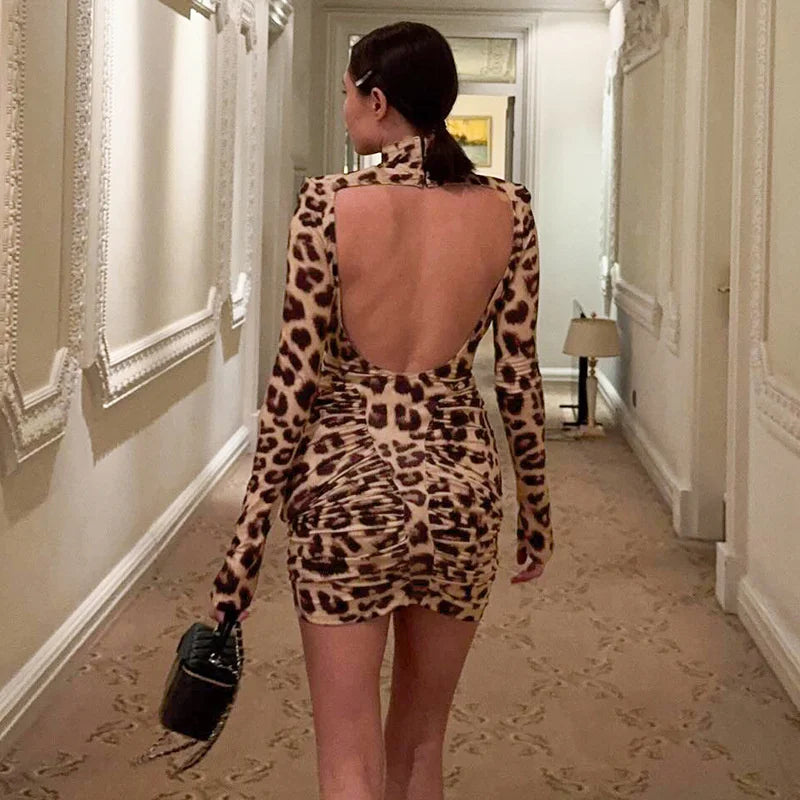 Backless turtleneck leopard mini dress styled for parties and dinner