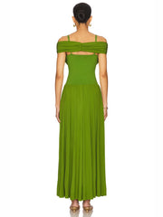 Back of a woman wearing a formal green maxi dress styled for weddings and cocktail events on a white background