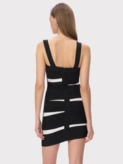 Skirt detail showing the mini length and angled stripe panel design, creating a streamlined silhouette with a modern graphic edge.