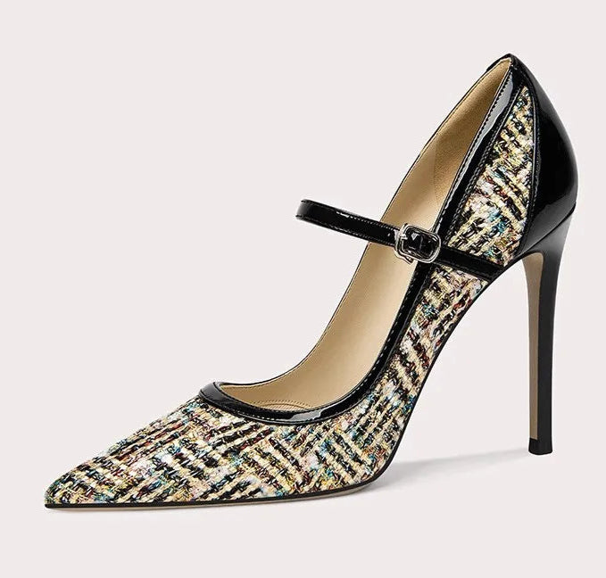 Side view of patent leather high heel pumps with stitching detail