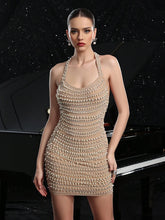 Woman wearing a beaded dress with a car in the background