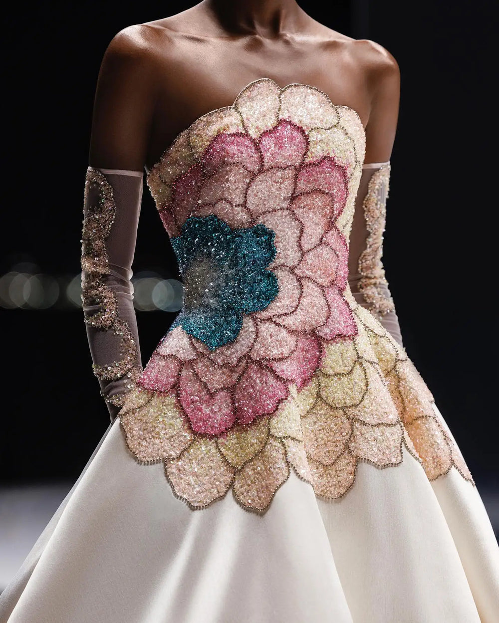 A close-up of the bodice of the strapless gown, showing the intricate beading.