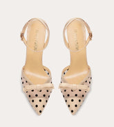 Beige polka dot bow heels for playful event styling