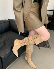 Beige flock knee-high fashion boots styled indoors