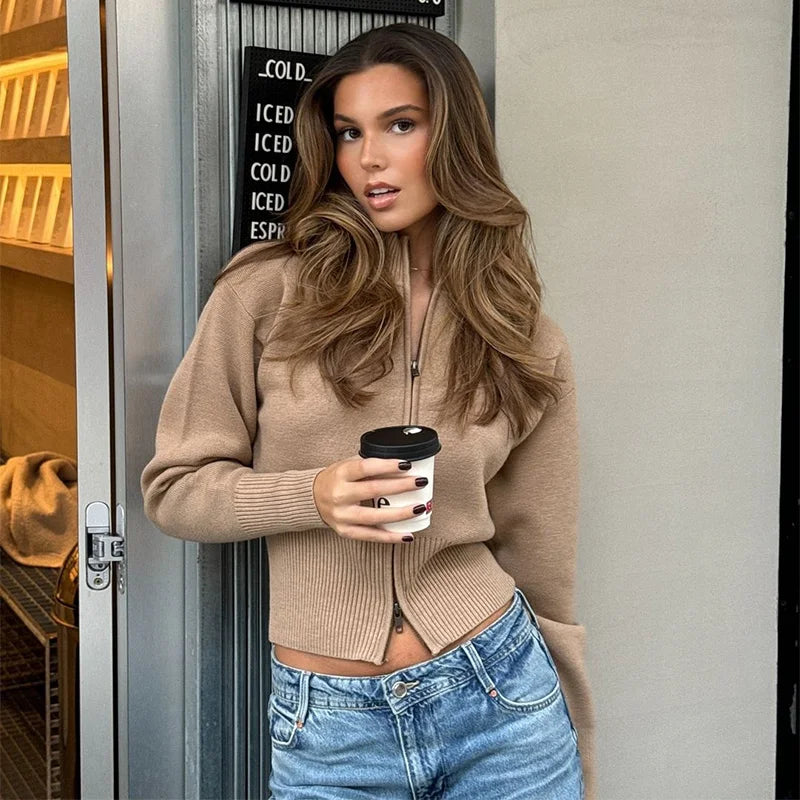 Woman in beige zip-up knit cardigan with stand-up collar