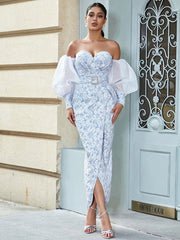 A full-length shot of a belted evening dress, highlighting its silhouette.