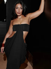 Backless black ankle-length sheath dress styled for an evening party