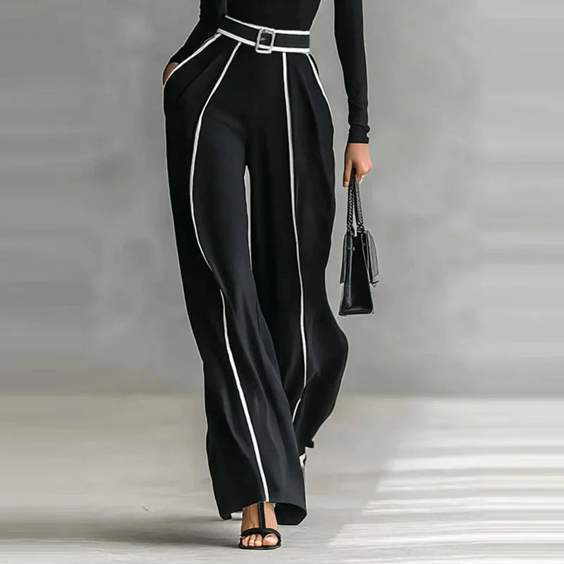 Black contrast stitch wide leg pants styled with heels for an urban day look