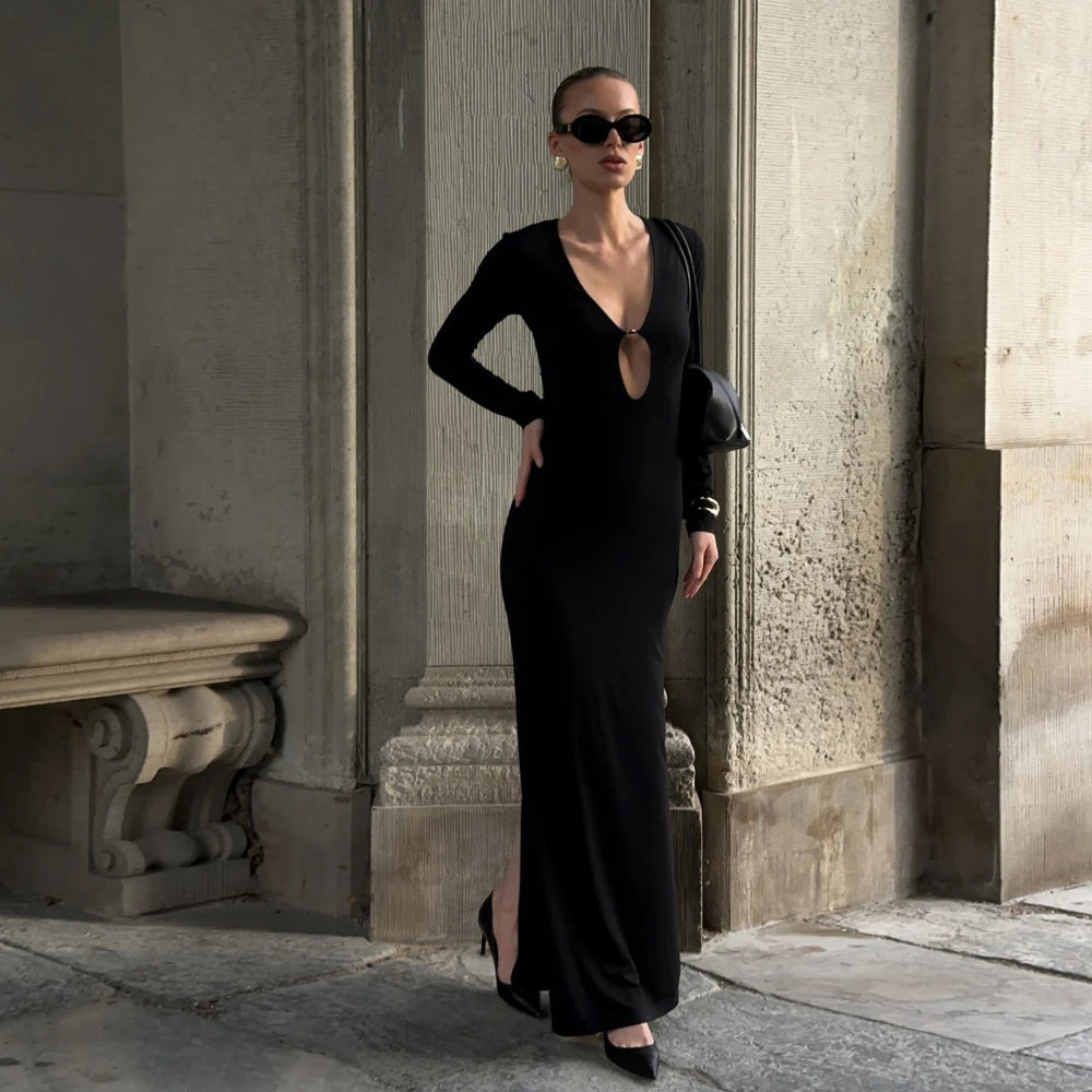 Black cutout sheath maxi dress styled for formal events and city nights