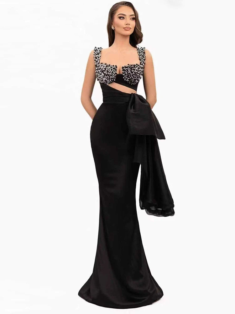 Black embroidered bow evening gown with spaghetti straps and v-neckline
