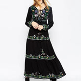 Black embroidered maxi dress styled with boho folk detailing