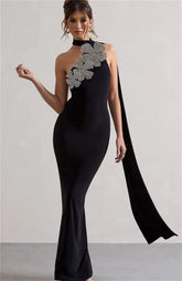Black floral embellished gown styled for formal evening events