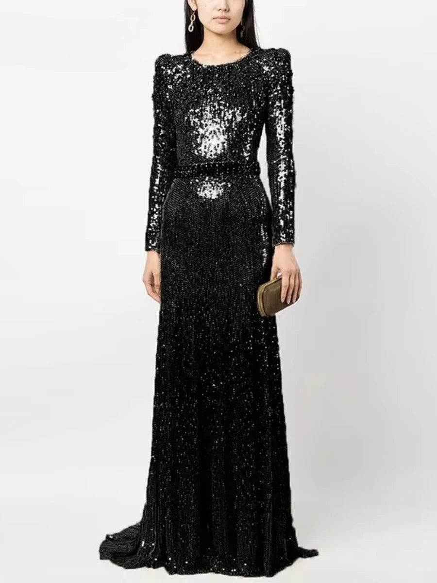 “Elegant black sequin dress styled for evening gala or reception”