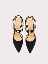 Black gold studded slingback heels styled for parties and formal events
