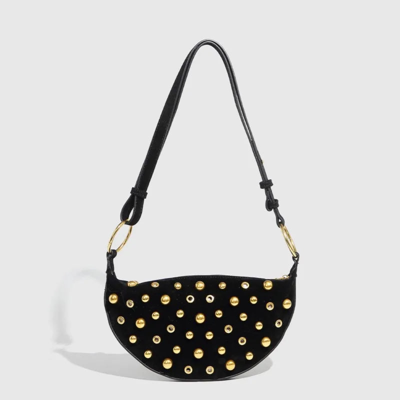 Black shoulder bag with gold-tone studs in Y2K hobo style