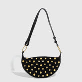 Black shoulder bag with gold-tone studs in Y2K hobo style