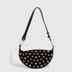 Black shoulder bag with gold-tone studs in Y2K hobo style