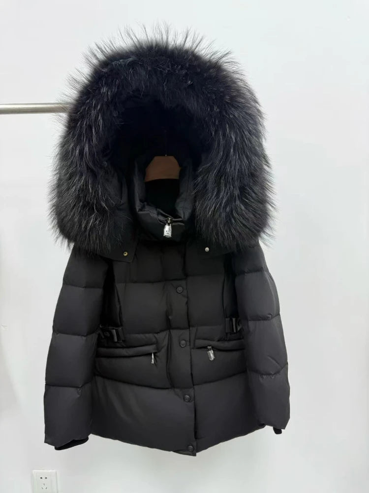 Front view of a thick black goose down coat with fur hood.